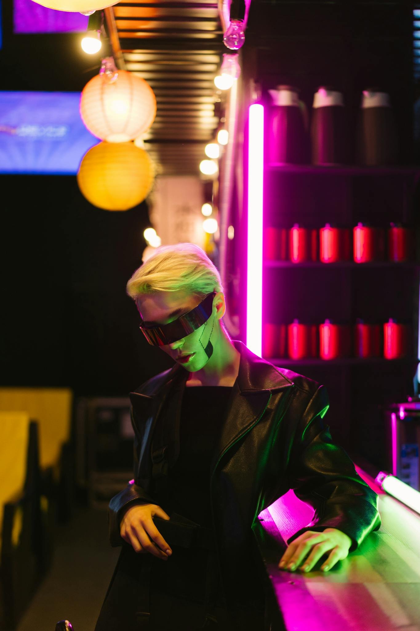 Stylish figure in cyberpunk sunglasses under vibrant neon lights, exuding futuristic vibes.
